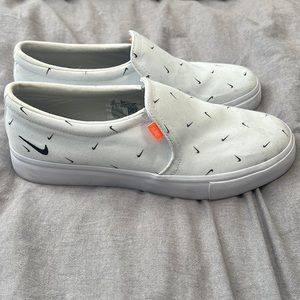 Women’s white Nike slip-ons size 9.5